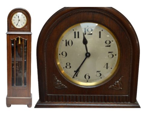 An early 20th century oak longcase clock with silvered circular dial with Arabic numerals and three brass weights, height 194