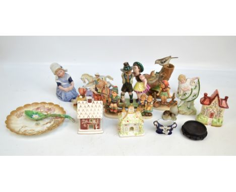 A group of various ceramic figures to include four Hummel examples and three Bisque examples, also two Coalport cottages, a D