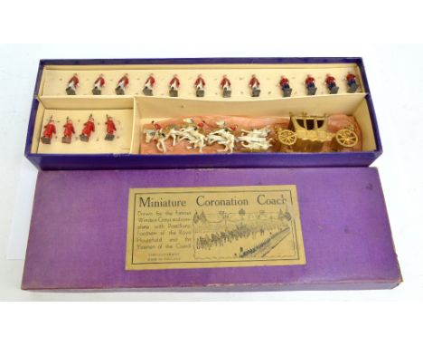 A boxed Johillco Series miniature coronation coach, complete with four postilions, four Yeoman of The Guard, and eight Footme
