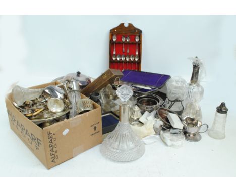 A quantity of mixed silver plated items to include galleried serving trays, bottle and table coasters, cruet sets, lidded muf