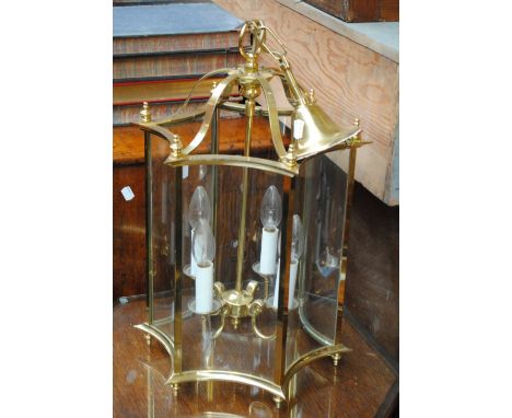 A modern brass concave hexagonal hall lantern, height (excluding ceiling attachment) 54cm.