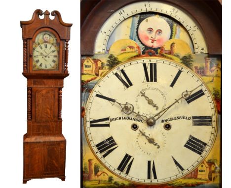 An early Victorian mahogany and inlaid longcase clock, the broken swan neck pediment above a painted arch dial set with a rol