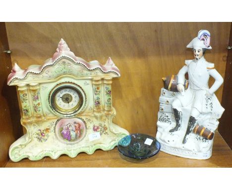 A 19th century Staffordshire flat-back figure of Emperor Napoleon, 40cm high and a Victorian ceramic mantel clock with clockw