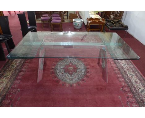 An Italian extending glass dining table by Naos, H.74 W.200 D.100cm (not extended)