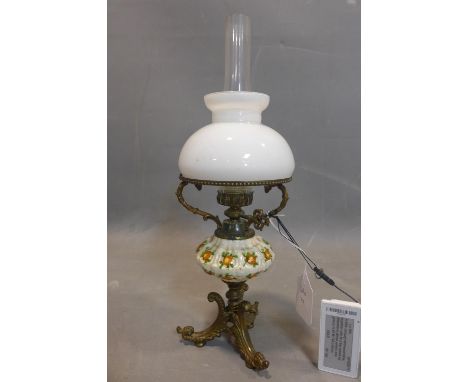 A late 19th century Continental oil lamp, with glass shades, crackle glaze bowl to centre and bras C-scroll supports, H.40cm 