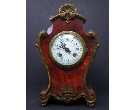 A French rouge marble table clock with double Roman/Arabic dial signed Samuel Marti Médaille d'Or Paris 1900, H.30 x W.22 x D