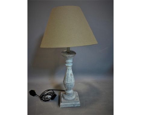 A distressed painted table lamp with cream shade, H.65cm (total) 