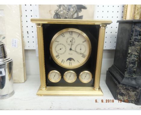 A fine quality Asprey &amp; Co moon face brass cased clock (A/F) battery operated, damage to foot