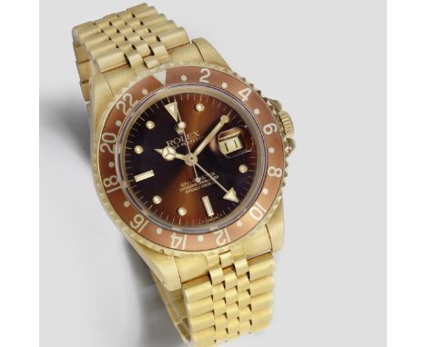 Rolex. An 18K gold automatic calendar bracelet watch with dual time zoneModel: GMT-MasterReference: 16758Date: Circa 1981Move