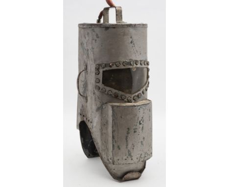 A homemade tin diving helmet:, the helmet is very tall and extremely narrow with weights built into two canisters attached to