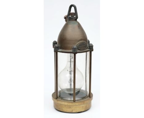 A submarine flood lamp by Siebe Gorman & Co Ltd , London:, the cased domed cover with swivel suspension and power inlet with 