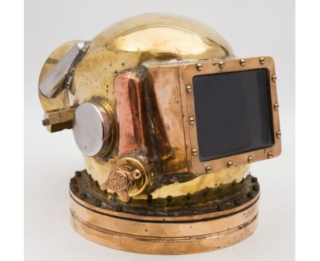  An American square faced helium diving helmet:, unsigned, 5 1/2 inch face plate with four inlets and outlets, helium scrubbe