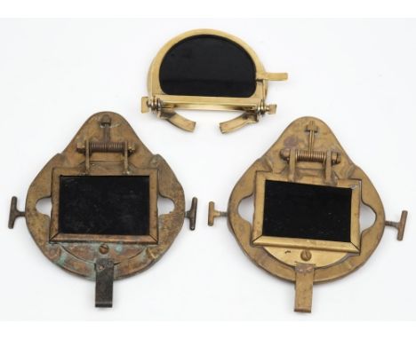 Two spring loaded diving helmet welding visors and a Russian welding visor: the rectangular visor mounted on a shaped plate w