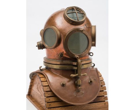 A French Navy no-bolt diving helmet by C H Petit, Paris:, numbered '24', four circular observation windows , the top window w