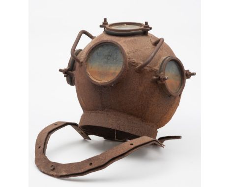 A homemade iron diving helmet:, with top handle and a further two handles either side of the front window, three of the four 