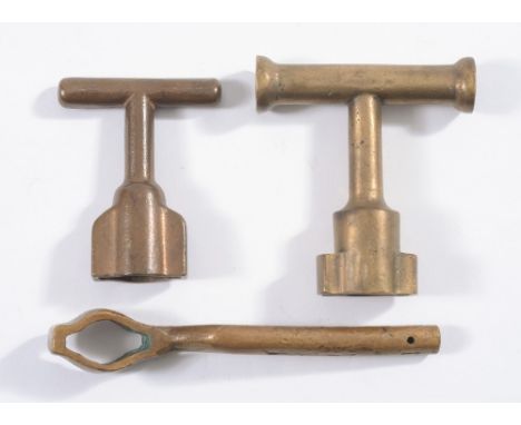 Two American 'T' spanners and a wrench:, one with solid handle possibly by Schrader the second with hollow handle, possibly b