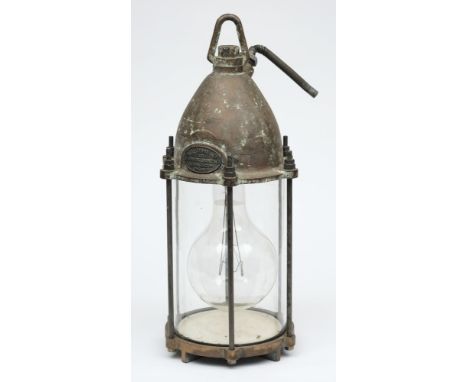 A submarine flood lamp by Siebe Gorman & Co Ltd, London:, the domed cover with swivel suspension and power inlet with maker's
