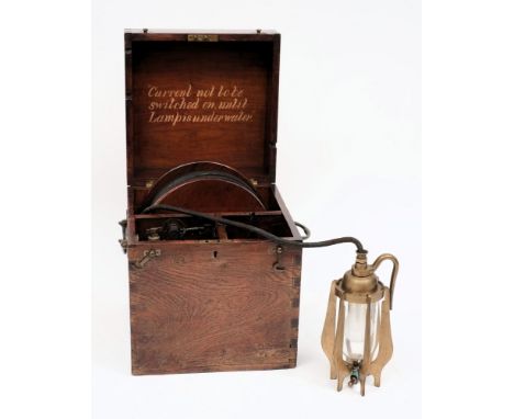 An early 20th century diving lamp in fitted oak case:, the lamp  constructed of six vanes around a pear shape glass shade wit