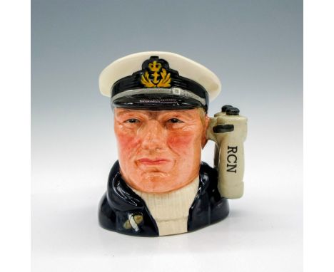Style One, Variation Two, with " R.C.N." on binoculars. White Royal Canadian Navy cap; dark brown coat; white sweater. Commis