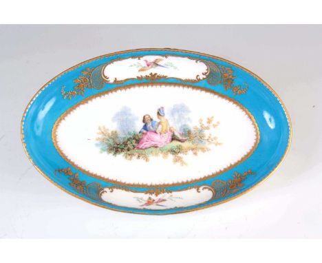 A FINE 18TH CENTURY SEVRES PORCELAIN SHALLOW OVAL DISH the gilded celestial blue ground decorated with a painted romantic sce