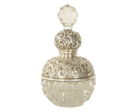 A GEORGE V SILVER TOPPED CUT GLASS PERFUME BOTTLE with embossed silver neck and cut glass stopper - London 191314.5cm high ov