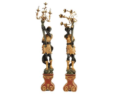 A PAIR OF 20TH CENTURY CARVED POLYCHROME BLACKAMOOR CARVED CANDELABRA each with seven branch gilt metal electrified tops210cm