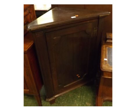 19th century oak corner cupboard, with single panel doors and planked reeded columns, raised on bracket feet, 32" wide x 18" 