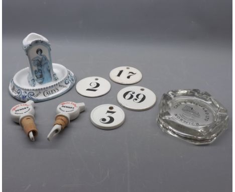 Caleys Table Waters match holder with built in ash tray, with printed scene of a lady water carrier, together with two Dewars