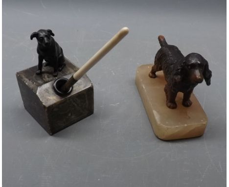 Painted spelter model of a spaniel on an agate base, together with an inkwell modelled as a bronze seated dog on an onyx base