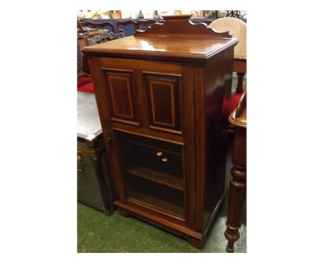 Mahogany and satinwood crossbanded music cabinet, of rectangular form with shaped pediment and moulded cornice to a panelled 