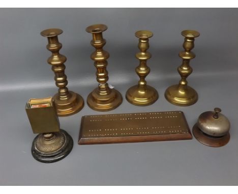 Mixed Lot: two pairs of Victorian brass candlesticks on circular bases, 9 1/2" and 8", together with a vintage metal desk bel