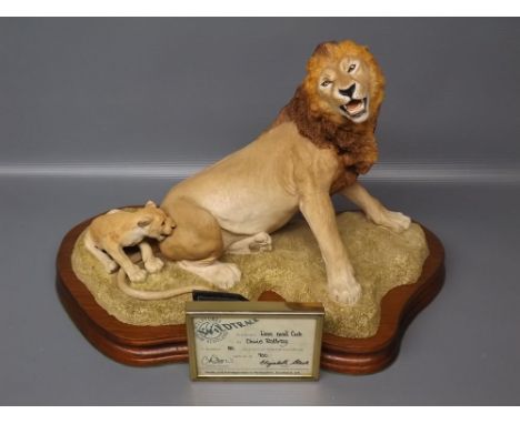 "Wild Track" model of a lion and cub by Chris Rottray, with framed certificate, raised on teak plinth 
