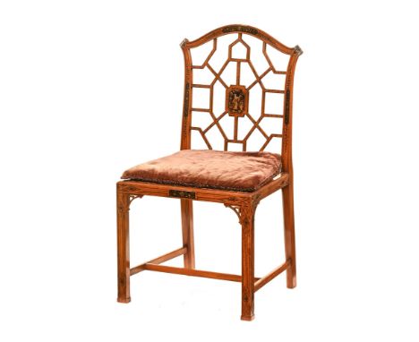 A Chinese Chippendale style side chair, 20th century with lacquered panel to back, loose cushion and cane seat raised on moul