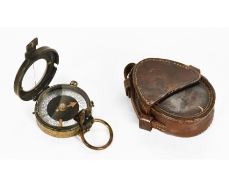 A leather cased military compass.