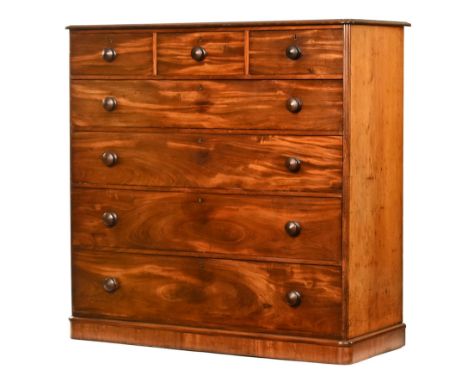 A large Victorian mahogany chest of drawers, three short and four long drawers with wooden knob handles and with plinth base,