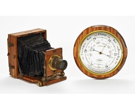A Lancaster half plate mahogany and brass mounted camera, together with a walnut cased barometer.