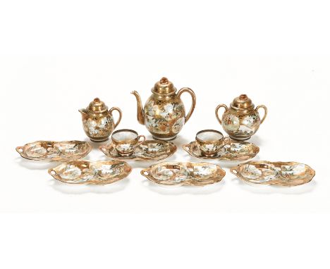 A Japanese Satsuma tea set, with teapot, cream jug, sugar jug, two teacups and six saucers.  Provenance: Captain Robert N Wal