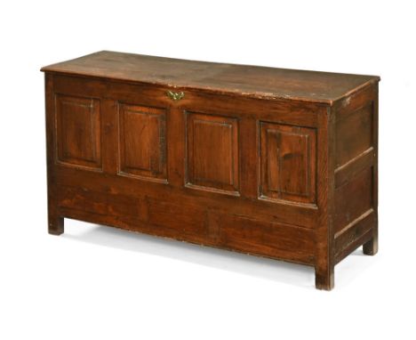 An 18th century oak four panel mule chest, with rectangular hinged top and square feet.  143 cm wide, 78 cm high, 49 cm deep.