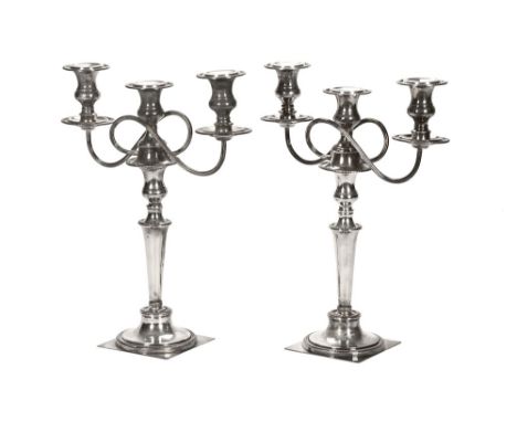 A pair of early 20th century plated three light candelabra. CONDITION REPORT: These candelabra are in used condition with ple