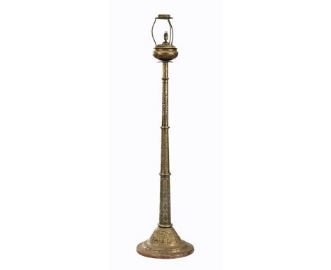 A large Eastern brass lamp standard, embossed with elephants and deities.  Height 192 cm.