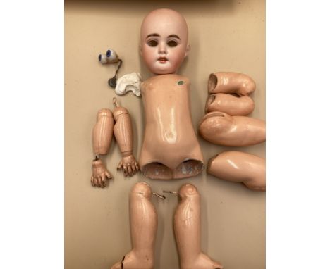 A German Armand Marseille bisque shoulder head doll, sleeping pale blue eyes, open mouth, light brown hair, cloth body comple