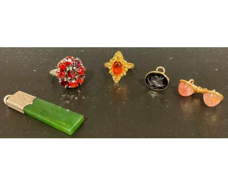 A selection of 9ct gold and silver jewellery, the 9ct gold jewellery includes a tested 9ct gold spessartine? garnet ring, siz