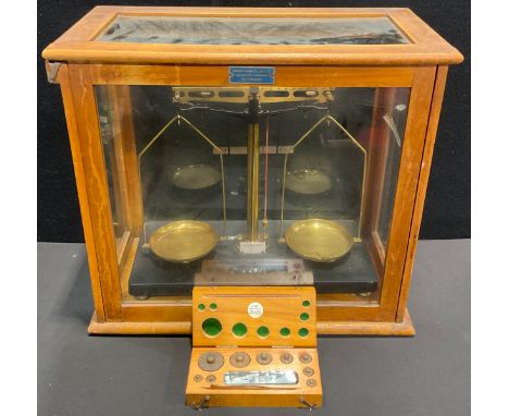 Scientific Instruments - a set of early /mid-century brass weighing scales, slide front glass display case, 40cm high, 44cm w