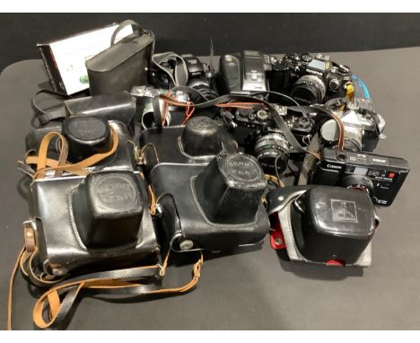 Photography - an Olympus OM10 35mm camera with single sequence attachment; an Olympus OM-1n 35mm camera, serial number 188111