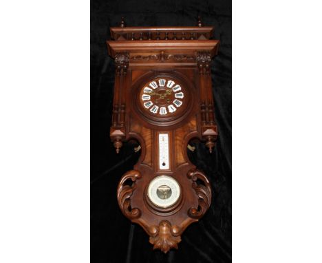 A late 19th century French walnut weather station clock, 17cm circular dial applied with Roman numerals, twin winding holes, 
