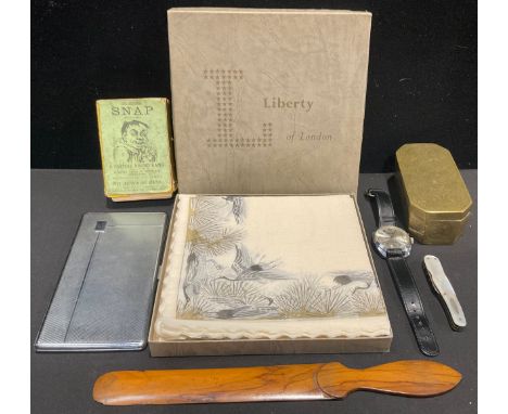 A set of Liberty of London paper napkins, printed with cranes, boxed; a brass "Persian" style box, the hinged cover hand engr