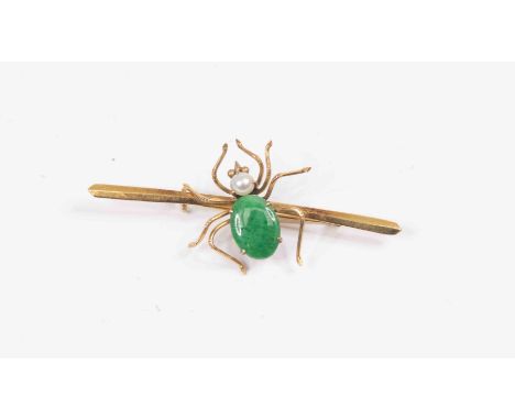 A spider set brooch, jade coloured stone set body, pearl head, mounted  in 14ct gold, length approx 53mm, total gross weight 