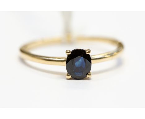 A sapphire solitaire, the oval sapphire weight approx 0.70ct, claw set in 18ct gold, size Q, total gross weight approx 1.7gms