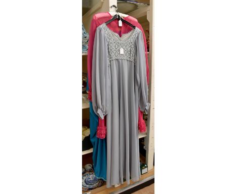 A collection of evening dresses to include a 1960's turquoise long dress, four buttons and a train, a shocking pink dress by 