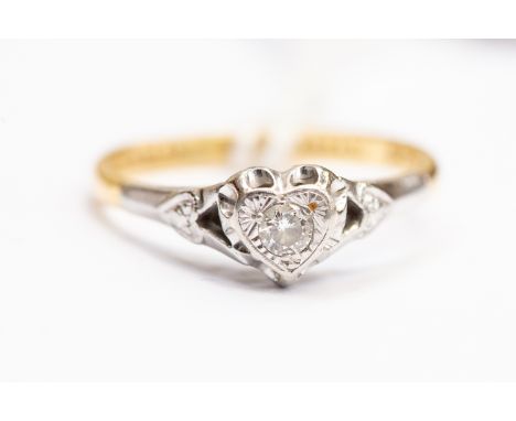 A diamond set dress ring, heart shaped mount set with a small brilliant cut diamond, platinum and 18ct gold, size L, total gr